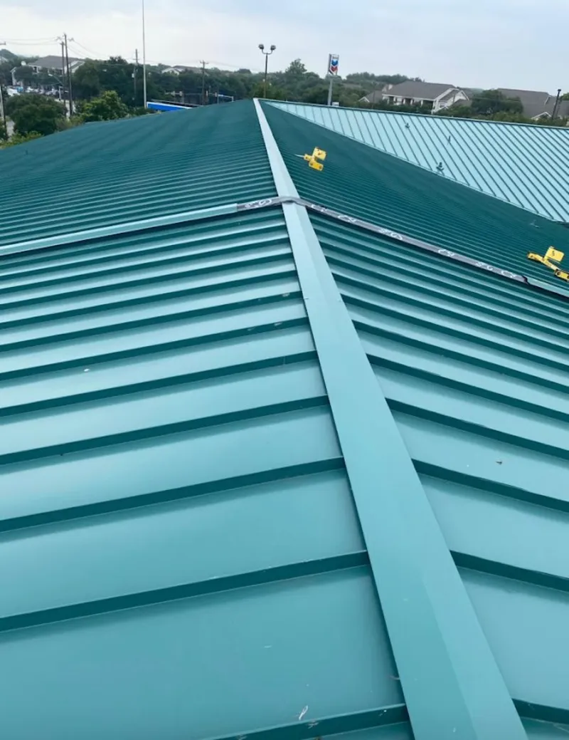 Green commercial metal roof ridge and valley for Metal Roof Repair in Wauwatosa