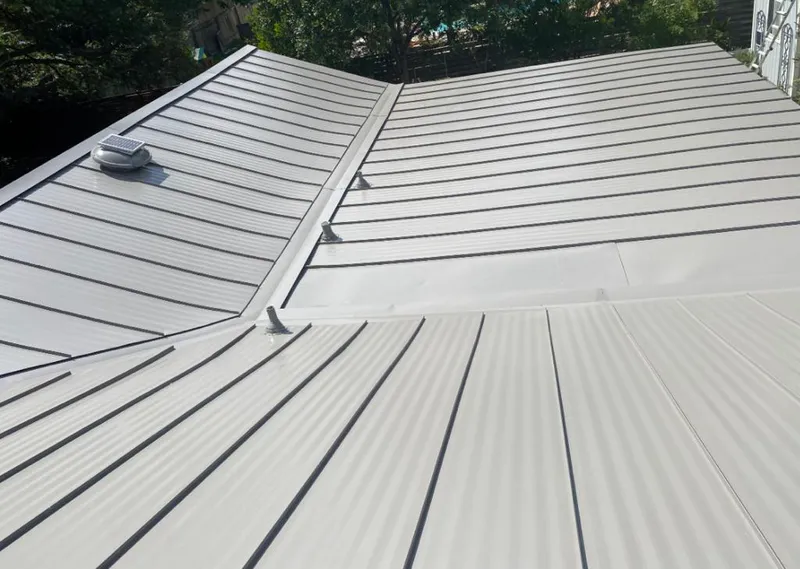 Solar attic fan installed on a metal roof for Roof Ventilation in Wauwatosa
